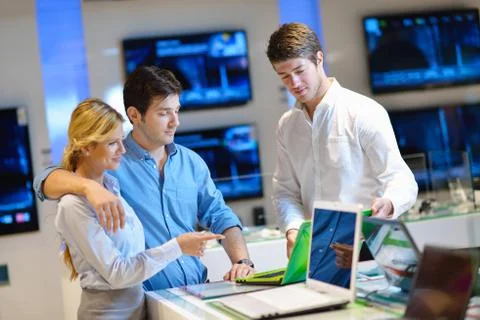 Young couple in consumer electronics store Stock Photos