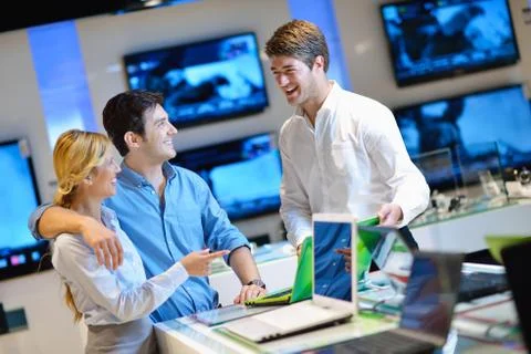 Young couple in consumer electronics store Stock Photos