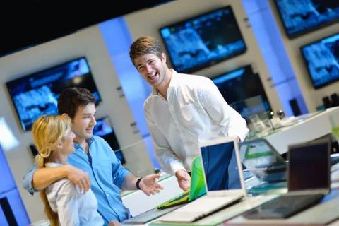 Young couple in consumer electronics store Stock Photos