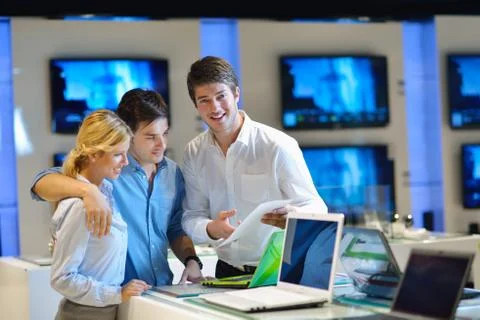Young couple in consumer electronics store Stock Photos
