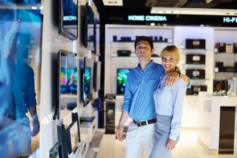 Young couple in consumer electronics store Stock Photos