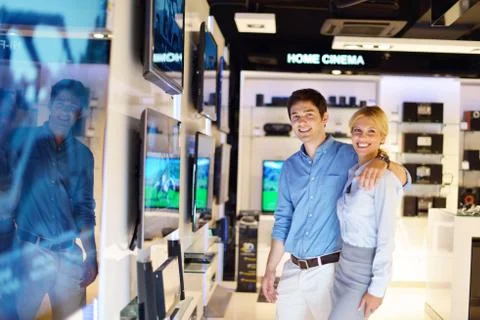 Young couple in consumer electronics store Stock Photos