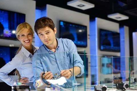Young couple in consumer electronics store Stock Photos