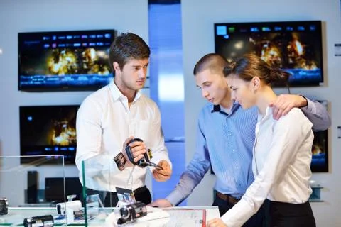 Young couple in consumer electronics store Stock Photos