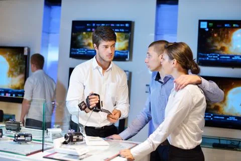 Young couple in consumer electronics store Stock Photos