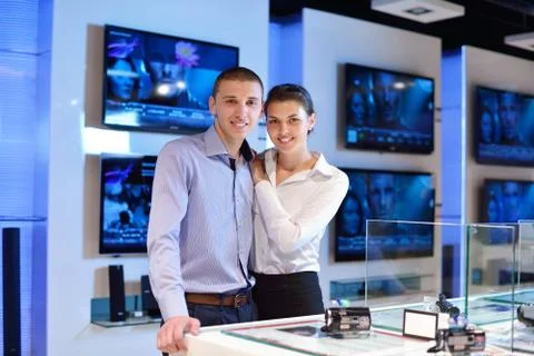 Young couple in consumer electronics store Stock Photos
