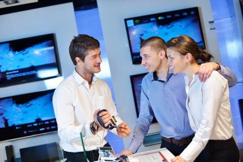 Young couple in consumer electronics store Stock Photos