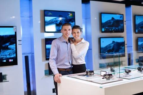 Young couple in consumer electronics store Stock Photos