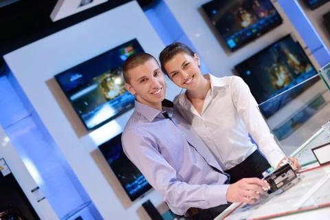 Young couple in consumer electronics store Stock Photos