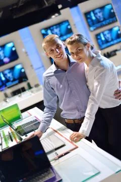 Young couple in consumer electronics store Stock Photos