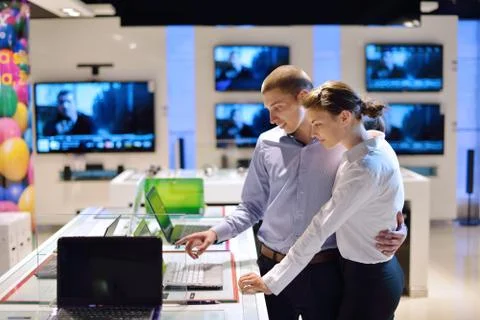 Young couple in consumer electronics store Stock Photos