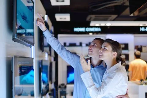 Young couple in consumer electronics store Stock Photos