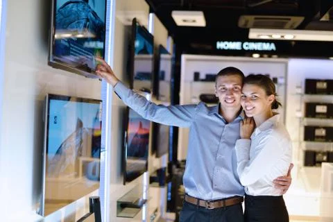 Young couple in consumer electronics store Stock Photos