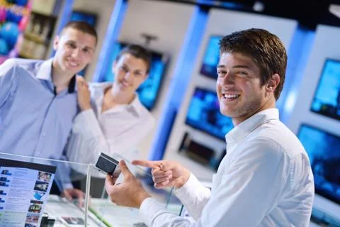 Young couple in consumer electronics store Stock Photos