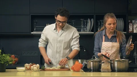 Young couple cooking in the kitchen Stock Footage 86195485