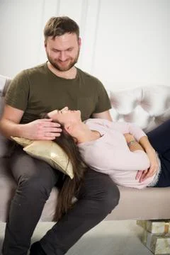 Young couple on the couch. Stock Photos
