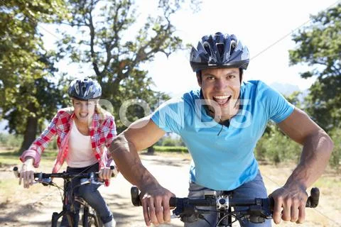 Young couple on country bike ride Stock Photos