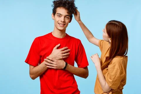Young couple cropped view studio blue background communication Stock Photos