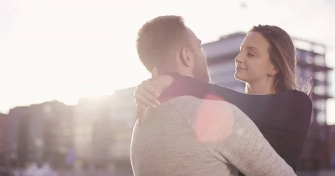 Young couple cuddling in sunset Stock Footage 79905366