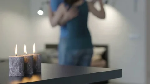 Young couple dancing by candlelight Stock Footage 81275024