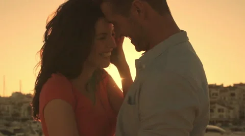 Young couple dancing by marina in sunset. Stock Footage 43668467