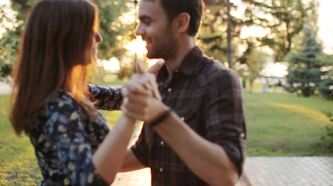 Young couple dancing in park Stock Footage 65235940