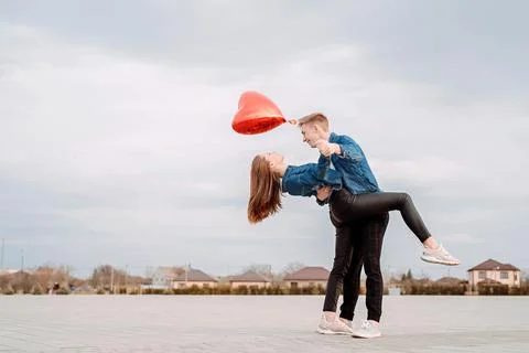 Young couple dancing passionate tango on the square in the park Stock Photos