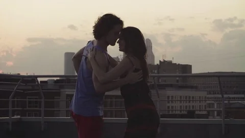 Young couple dancing on sunset Stock Footage 79121636