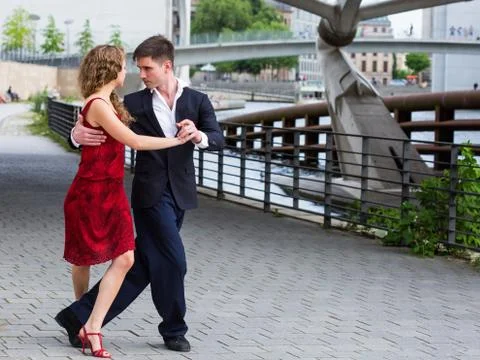 Young couple dancing tango outside Stock Photos