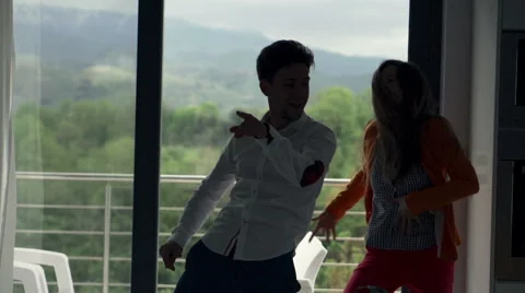 Young couple dancing by window at home, slow motion 240fps Stock Footage 55406575