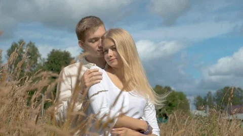 Young couple on date in wheat field. Stock Footage 79770159