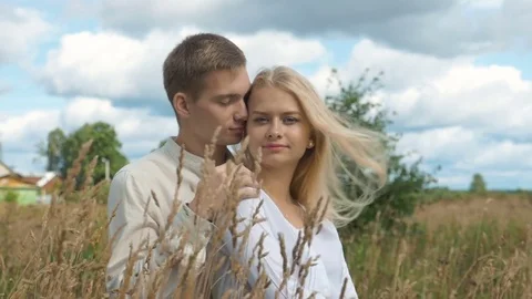 Young couple on date in wheat field. slow motion Stock Footage 80273822