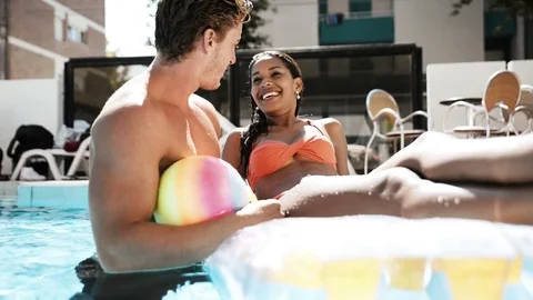 Young couple dating in the pool Stock Footage
