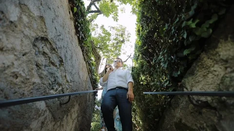 Young Couple Descends Down The Stairs. Stock Footage 108014701