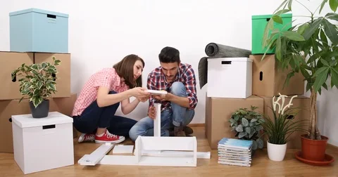 Young Couple Do It Yourself Match Wood Parts Manual Assemble New Home Property 스톡 동영상 77022722