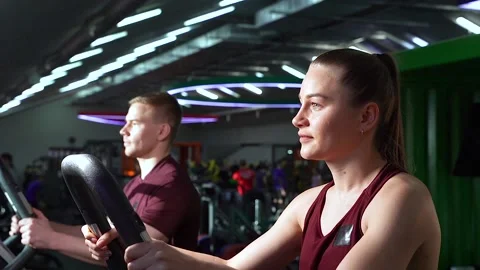 Young couple doing cardio workout together at the gym. Stock Footage 102262697