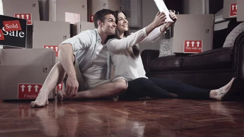 Young couple doing selfie or self portrait in for memories in there new apartmen Stock-Footage 199631214