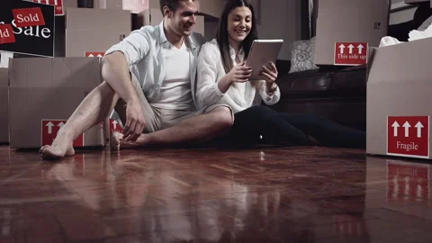Young couple doing selfie or self portrait in for memories in there new apartmen Stock Footage 199631221