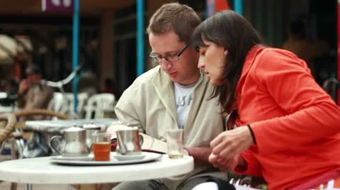 Young couple drinking tea in bar, outdoors Видео 10786536