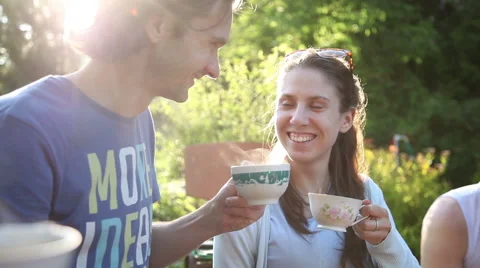 Young couple drinking tea in the park Stock Footage 51449390