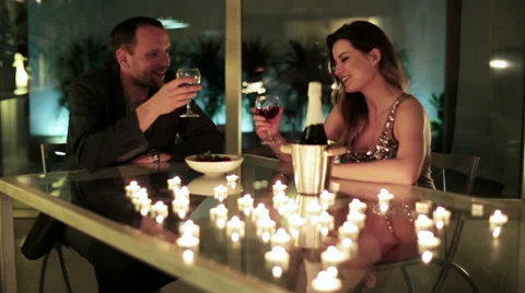 Young couple drinking wine and feeding each other with Stock Footage 37126105