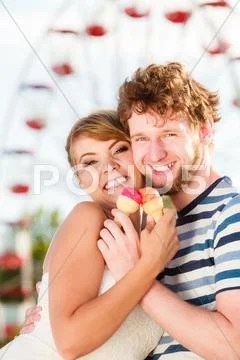 Young couple eating ice cream outdoor Stock Photos