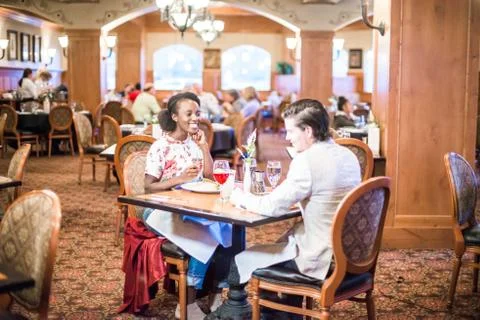Young Couple Eats Dinner Together at Nice Restaurant Stock Photos