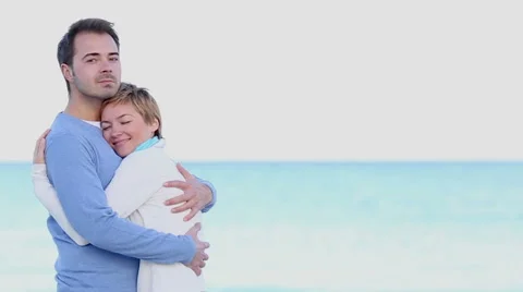 Young couple embracing on the beach Stock Footage 46025205