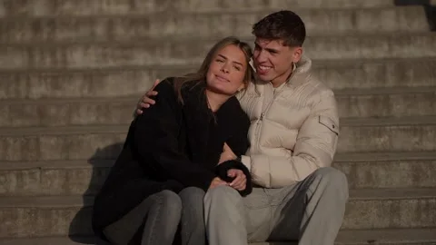 Young Couple Embracing on Steps in Paris France Romantic Moment Candid Portrait Stock Footage 325267776