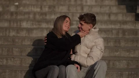 Young couple embracing on stone steps in Paris France Romantic moment with Stock Footage 325264348