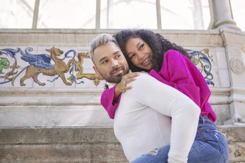Young couple, embracing while having their picture taken 库存照片
