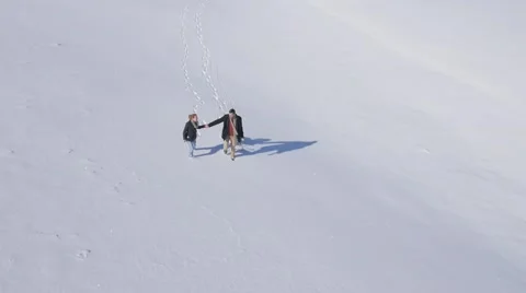 Young couple enjoy on the snow Видео 58744162