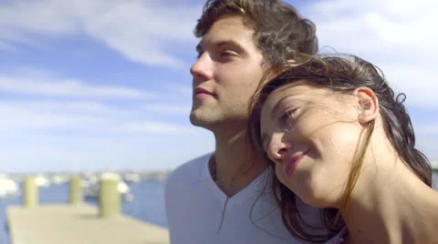 Young Couple Enjoy The View From A Dock At A Marina Video stock 54986463