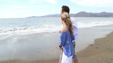 Young Couple enjoying beach Stock Footage 41969751